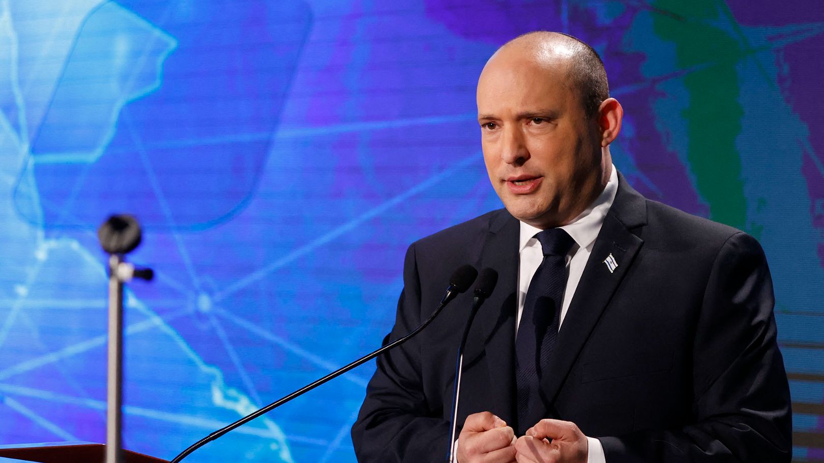 Israel's Prime Minister Naftali Bennett speaks at the Reichman University's Institute for Policy and Strategy (IPS) in the Mediterranean coastal city of Herzliya on November 23, 2021. (Photo by JACK GUEZ / AFP)