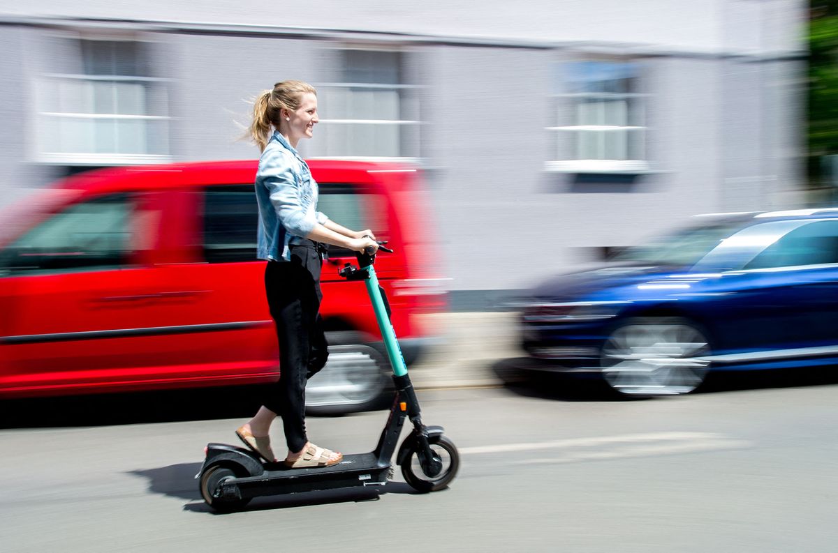 12 June 2020, Lower Saxony, Hanover: Lina rides an electric scooter from the electric scooter sharing provider Tier Mobility (shot with a long shutter speed). E-scooters have been available for use in Germany for a year now. Originally the electric scooters were supposed to promote environmentally friendly mobility according to the Federal Ministry of Transport. Photo: Hauke-Christian Dittrich/dpa (Photo by Hauke-Christian Dittrich / DPA / dpa Picture-Alliance via AFP)
