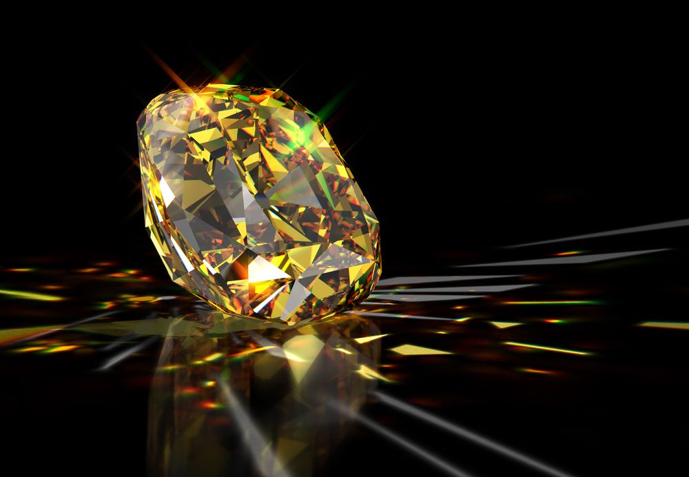 Sparkling,Yellow,Cushion-cut,Diamond,With,Colorful,Caustics,Rays,,Laying,On