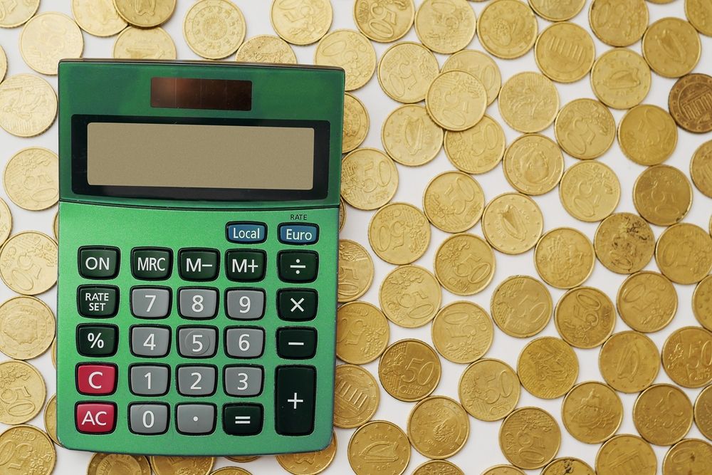 Green,Calculator,On,Fifty,Cents,Coins.,Financial,And,Banking,Industry.