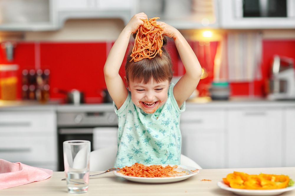 Adorable,Little,Girl,Eating,Spaghetti,At,Table
