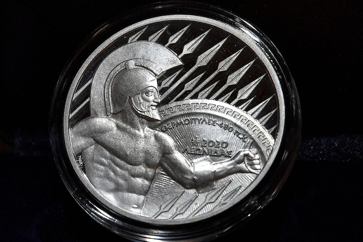 A picture taken on February 11, 2020 shows a collectible commemorative 10-euro silver coins presented at the Bank of Greece headquarters in Athens, to mark 2.500 years since the battle of Thermopylae. - The silver coin, commemorating the 480 B.C battle and depicting the ancient Spartan warrior King Leonidas will be soon in circulation. (Photo by LOUISA GOULIAMAKI / AFP)
