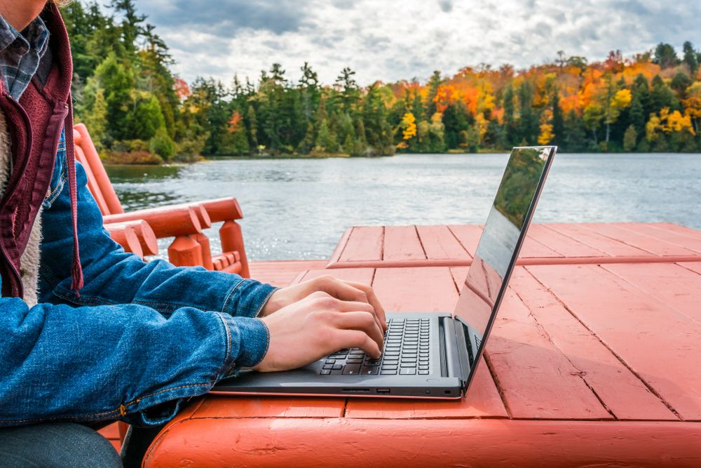 Work,From,Anywhere,-,Working,On,Laptop,Beneath,The,Autumn