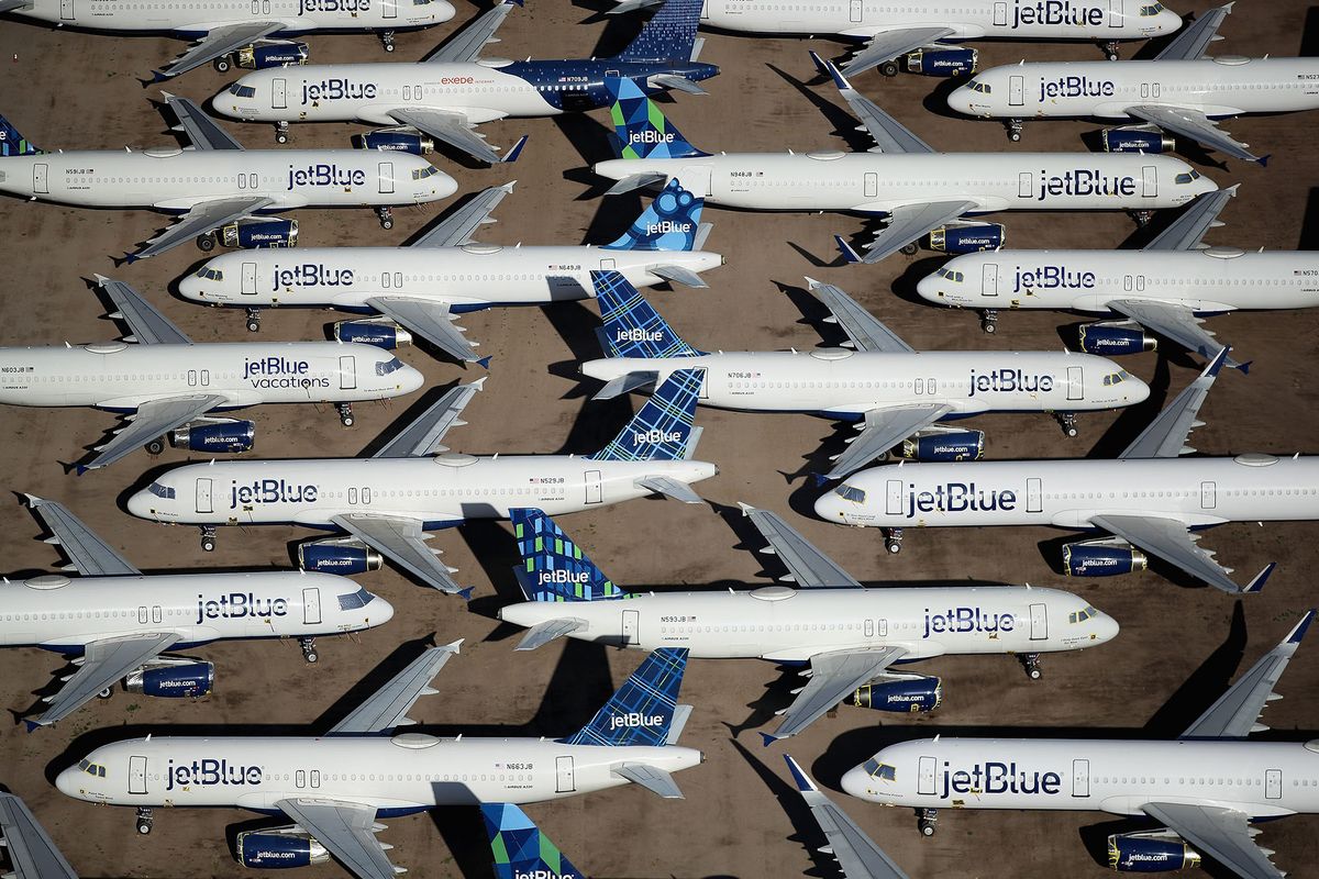 MARANA, ARIZONA - MAY 16: Decommissioned and suspended jetBlue commercial aircrafts are seen stored in Pinal Airpark on May 16, 2020 in Marana, Arizona.  Pinal Airpark is the largest commercial aircraft storage facility in the world, currently holding increased numbers of aircraft in response to the coronavirus COVID-19 pandemic.   (Photo by Christian Petersen/Getty Images) 1225261138