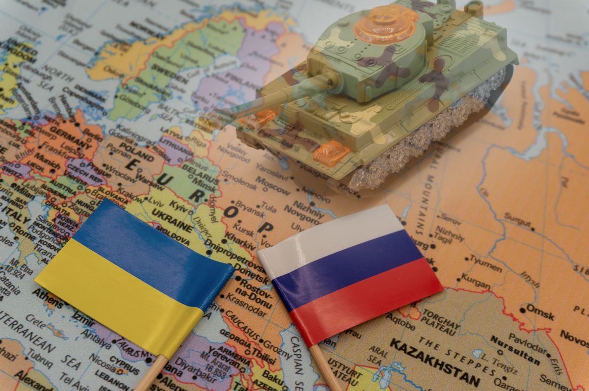 Ukrainian,And,Russian,Flags,Placed,On,A,Map,Of,Europe.