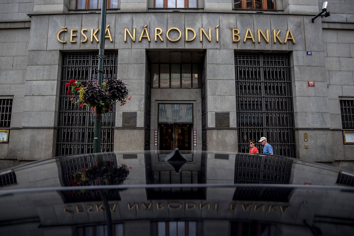 Pedestrians pass the entrance to the headquarters of the Czech Central Bank (CNB) in Prague, Czech Republic, on Thursday, Aug. 3, 2017. Czech policy makers kicked off monetary tightening in Europe this year as economic growth fuels wage increases and inflation pressures build. Photographer: Martin Divisek/Bloomberg via Getty Images 825933898