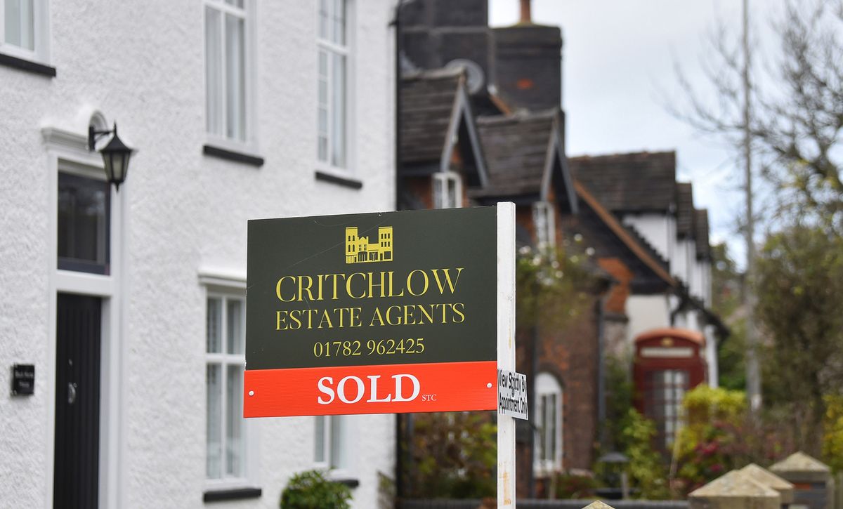 CREWE, ENGLAND - NOVEMBER 18: A close up of a Critchlow Estate Agents sold sign on November 18, 2020 in Crewe, Cheshire. The United Kingdom will continue to impose lockdown measures until December 2 in an attempt to curb transmissions of the coronavirus (COVID-19).  (Photo by Nathan Stirk/Getty Images) 1286371601