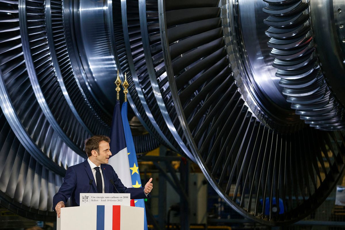 French President Emmanuel Macron delivers a speech at the GE Steam Power System main production site for its nuclear turbine systems in Belfort, eastern France, on February 10, 2022, as part of a visit dedicated to energy policy and the future of the country's atomic industry, which provides around 70 percent of French electricity. - French President Emmanuel Macron is set to throw his support behind a massive nuclear power plant programme during his visit, despite concerns about the cost and complexity of building new reactors. (Photo by Jean-Francois Badias / POOL / AFP)