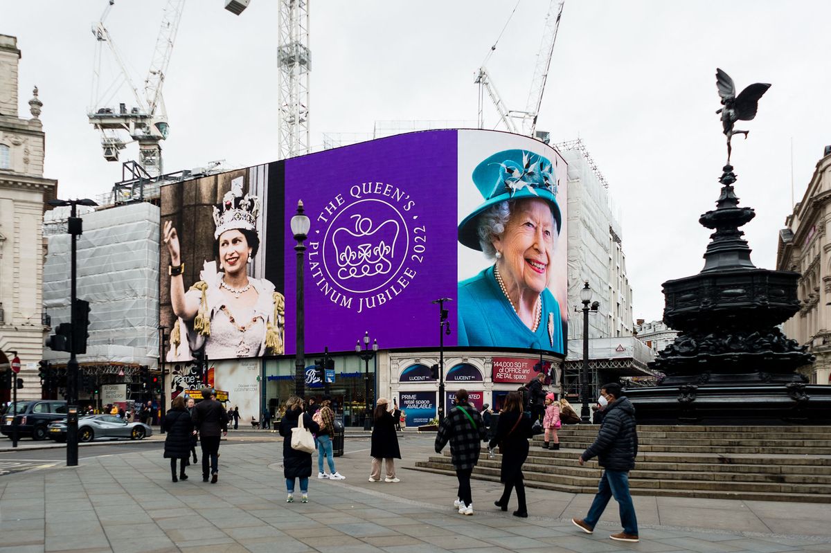 Images of Queen Elizabeth II are displayed on the lights in London's Piccadilly Circus to mark her Platinum Jubilee in London, Britain, 6 February 2022. Queen Elizabeth II will celebrate her platinum Jubilee marking 70 years on the throne. The then 25-year-old ascended to the throne on February 6, 1952 following her father George VI's death. It was the first coronation ever to be televised, with 27million people in the UK tuning in. (Photo by Maciek Musialek/NurPhoto) (Photo by Maciek Musialek / NurPhoto / NurPhoto via AFP)