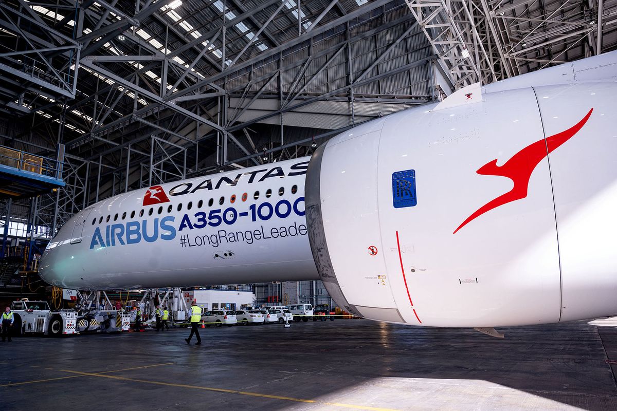 An Airbus A350-1000 aircraft is seen inside a hangar at Sydney international airport on May 2, 2022, to mark a major fleet announcement by Australian airline Qantas. - Qantas announced on May 2 it will launch the world's first non-stop commercial flights from Sydney to London and New York by the end of 2025, finally conquering the "tyranny of distance". (Photo by Wendell TEODORO / AFP)