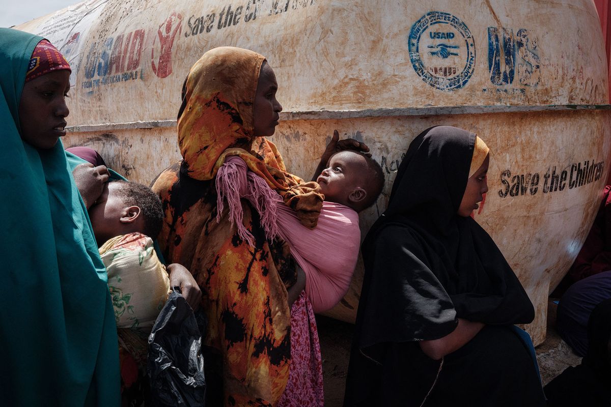 Mothers wait for high nutrition foods and health services at Tawkal 2 Dinsoor camp for internally displaced persons (IDPs) in Baidoa, Somalia, on February 14, 2022. Insufficient rainfall since late 2020 has come as a fatal blow to populations already suffering from a locust invasion between 2019 and 2021, the Covid-19 pandemic. For several weeks, humanitarian organizations have multiplied alerts on the situation in the Horn of Africa, which raises fears of a tragedy similar to that of 2011, the last famine that killed 260,000 people in Somalia. - Desperate, hungry and thirsty, more and more people are flocking to Baidoa from rural areas of southern Somalia, one of the regions hardest hit by the drought that is engulfing the Horn of Africa. (Photo by YASUYOSHI CHIBA / AFP)