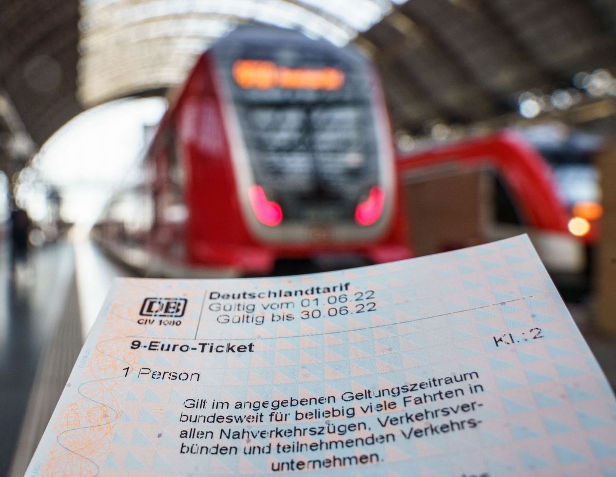 23 May 2022, Hessen, Frankfurt/Main: ILLUSTRATION - A 9-euro ticket freshly purchased at a Deutsche Bahn vending machine, photographed at Frankfurt's main train station. In Hesse, sales of the cheap tickets for local public transport began nationwide. The monthly ticket in response to the sharp rise in energy prices will be available from June to August. Photo: Frank Rumpenhorst/dpa (Photo by FRANK RUMPENHORST / DPA / dpa Picture-Alliance via AFP)
