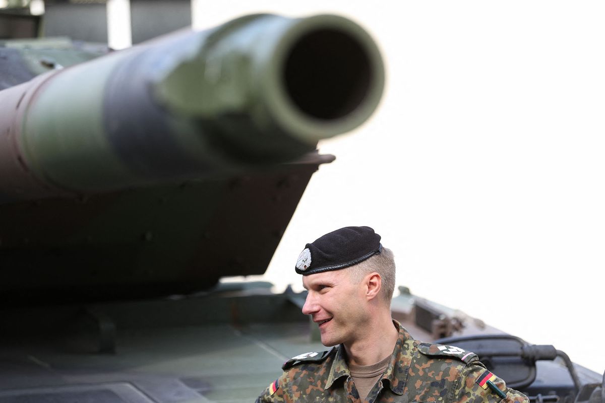 16 September 2020, North Rhine-Westphalia, Paderborn: German Lieutenant Colonel Marco Maulbecker is standing next to a Leopard 2A6M tank on the Normandy Barracks grounds in Paderborn-Sennelager. German soldiers and representatives of the British armed forces in Germany train combat situations in a special combat simulation centre. The training weeks focus on the deployment of a tank platoon of both combat reconnaissance units. This makes it one of the most demanding operations of armoured forces in land-based operations. Photo: Friso Gentsch/dpa (Photo by FRISO GENTSCH / DPA / dpa Picture-Alliance via AFP)