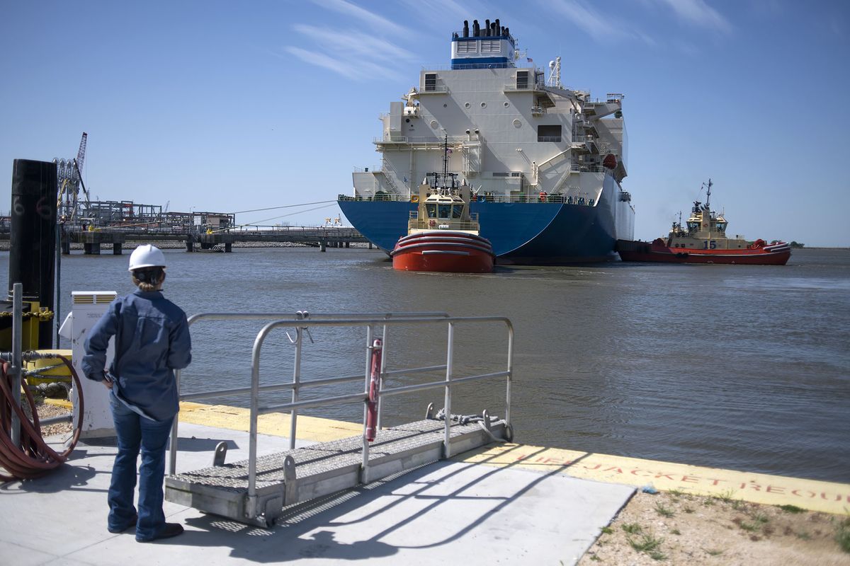 1239984861 A tug boat pulls out an LNG Tanker vessel at the Cheniere Sabine Pass Liquefaction facility in Cameron, Louisiana, U.S., on Thursday, April 14, 2022. Cheniere Energy, Inc. is the largest producer and exporter of liquefied natural gas (LNG) in the United States and the second-largest LNG operator in the world. Photographer: Mark Felix/Bloomberg via Getty Images
