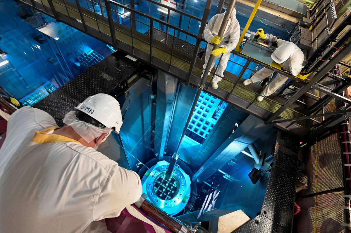 EDF employees remove a nuclear fuel bar from the storage poolat the Fessenheim nuclear power plant on June 21, 2021, in Fessenheim, eastern France. - French utility EDF on June 29, 2020 permanently shut down unit 2 of the Fessenheim nuclear power plant as scheduled as part of the country's energy transition law. (Photo by SEBASTIEN BOZON / AFP)