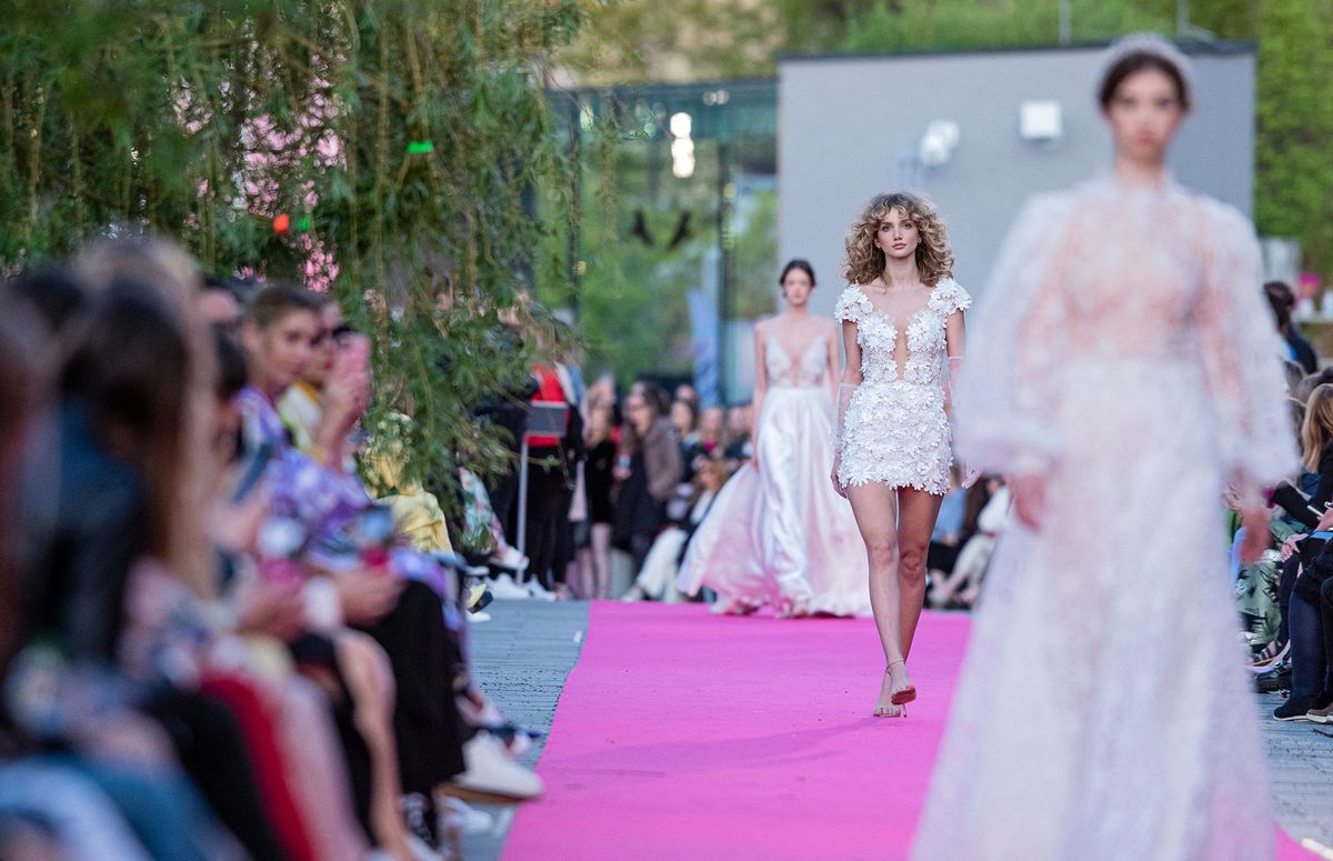 A model presents a creation by Hungarian designer Anita Benes 20th anniversary wedding collection during Daalarna Fashion Show on Apr. 29, 2022 at Millen·ris-SzÈllkapu Park in Budapest, Hungary. (Photo by Robert SzaniszlÛ/NurPhoto) (Photo by Robert Szaniszlo / NurPhoto / NurPhoto via AFP)
