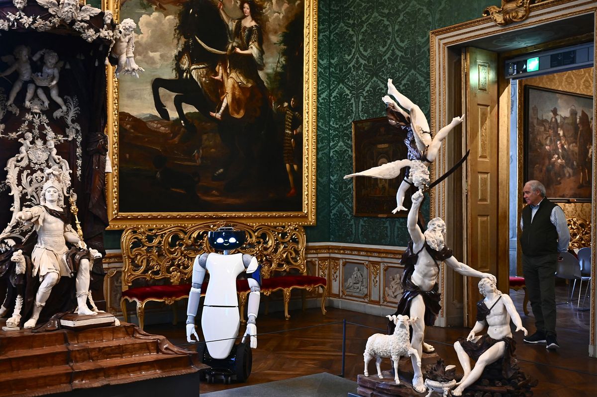 A photo shows the humanoid robot R1, designed by the Italian Institute of Technology, serving as a virtual guide for visitors at the Palazzo Madama museum in Turin on May 12, 2021. - The experimentation is part of the European Union funded project 5G-TOURS that aims to test and use 5G technologies to provide useful, efficient and reliable services to citizens and tourists. The robot is able to describe the works and answer questions relating to the author or the historical period to which they belong. (Photo by MARCO BERTORELLO / AFP)