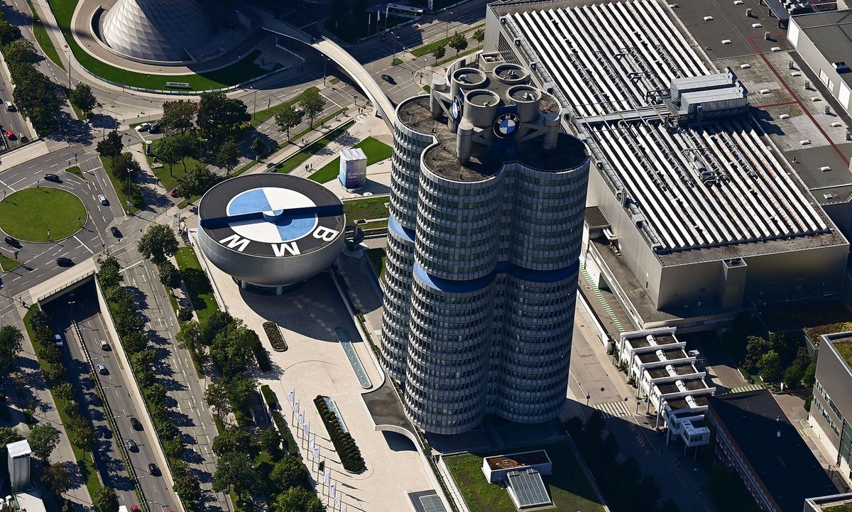 An aerial view shows shows the headquarters of German carmaker BMW in Munich on September 5, 2021. (Photo by Tobias Schwarz / AFP)