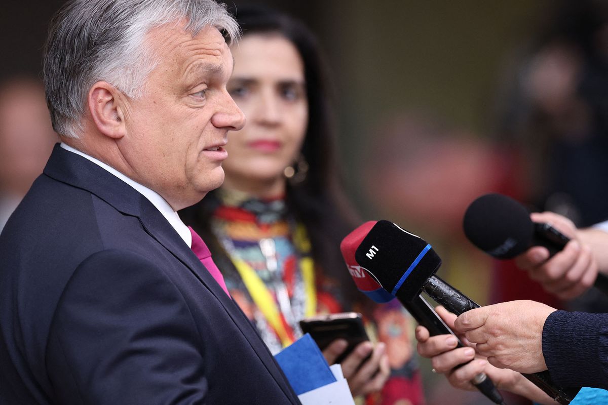 Hungary's Prime Minister Viktor Orban talks to press as he arrives for the first day of a special meeting of the European Council at The European Council Building in Brussels on May 30, 2022. (Photo by Kenzo TRIBOUILLARD / AFP)