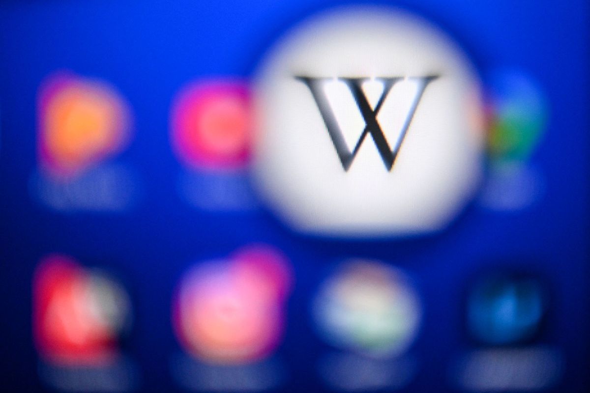 A picture taken on April 15, 2022 in Moscow shows the Wikipedia logo is seen on a tablet screen. (Photo by Kirill KUDRYAVTSEV / AFP)