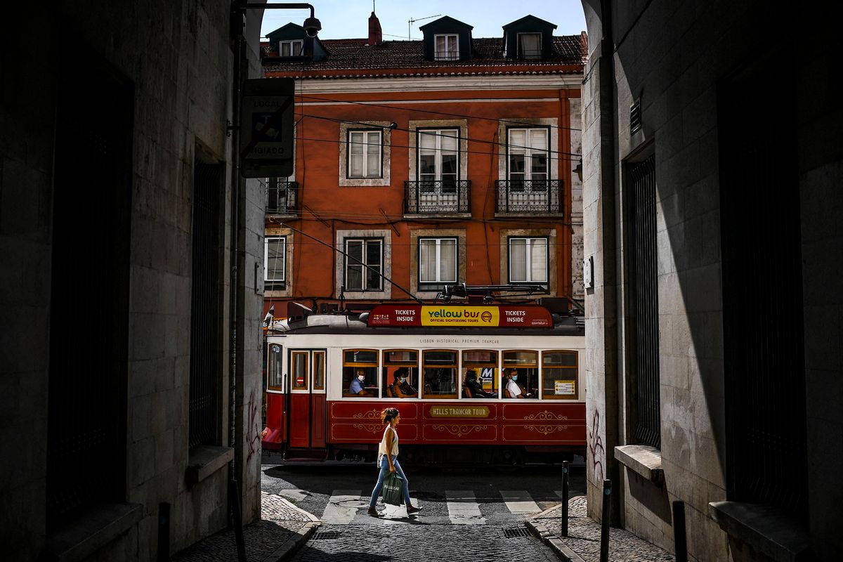 A tram passes by in Bairro Alto neighborhood in Lisbon on September 22, 2020. (Photo by PATRICIA DE MELO MOREIRA / AFP)