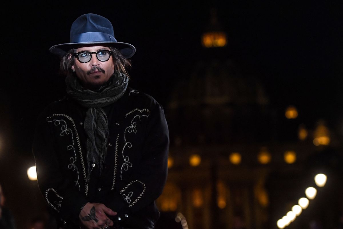 US actor Johnny Depp arrives to deliver a masterclass at the Auditorium della Conciliazione venue in Rome on October 17, 2021 within the "Alice nella citta" parallel section of the 16th Rome Film Festival. - Depp earlier presented the animated TV mini series "Puffins", in which he acts as voice talent. (Photo by Tiziana FABI / AFP)