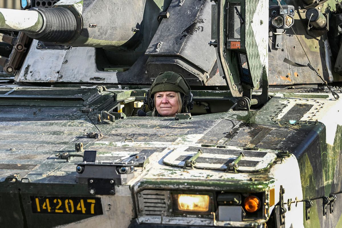 Sweden's Prime Minister Magdalena Andersson drives a combat vehicle during a visit to the international military exercise Cold Response 22 in Norway, March 21, 2022. Cold Response is a Norwegian-led winter exercise in which NATO and partner countries participate. Sweden participates with 1,500 soldiers and officers and is organized together with Finnish army units. Photo: Anders Wiklund / TT / code 10040 (Photo by ANDERS WIKLUND / TT NEWS AGENCY / TT News Agency via AFP)