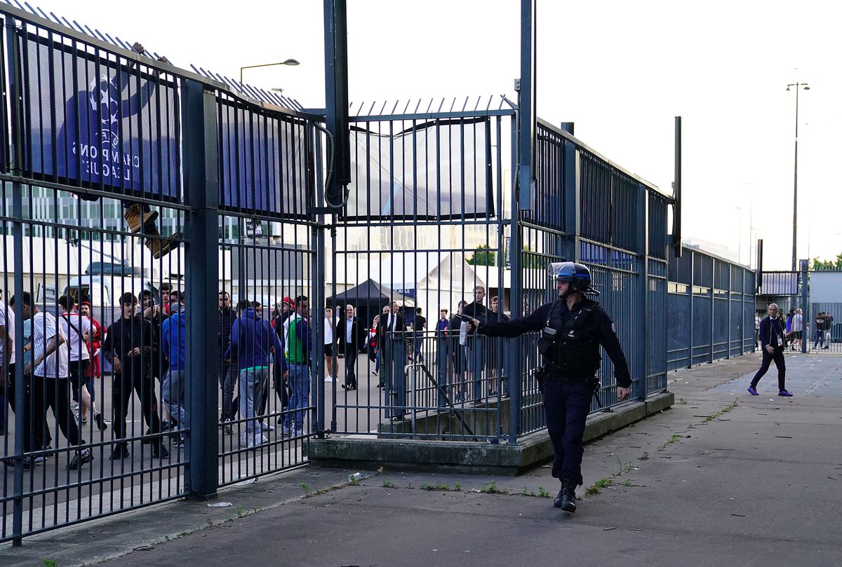 1240961071 Police use pepper spray against fans outside the ground as the kick off is delayed during the UEFA Champions League Final at the Stade de France, Paris. Picture date: Saturday May 28, 2022. (Photo by Adam Davy/PA Images via Getty Images)