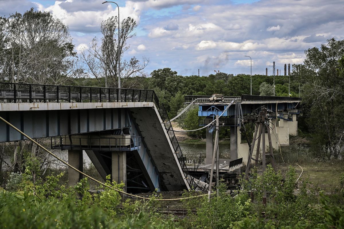 A picture taken on May 22, 2022, shows the destroyed bridge connecting the city of Lysychansk with the city of Severodonetsk in the eastern Ukranian region of Donbas, amid Russian invasion of Ukraine. (Photo by ARIS MESSINIS / AFP)