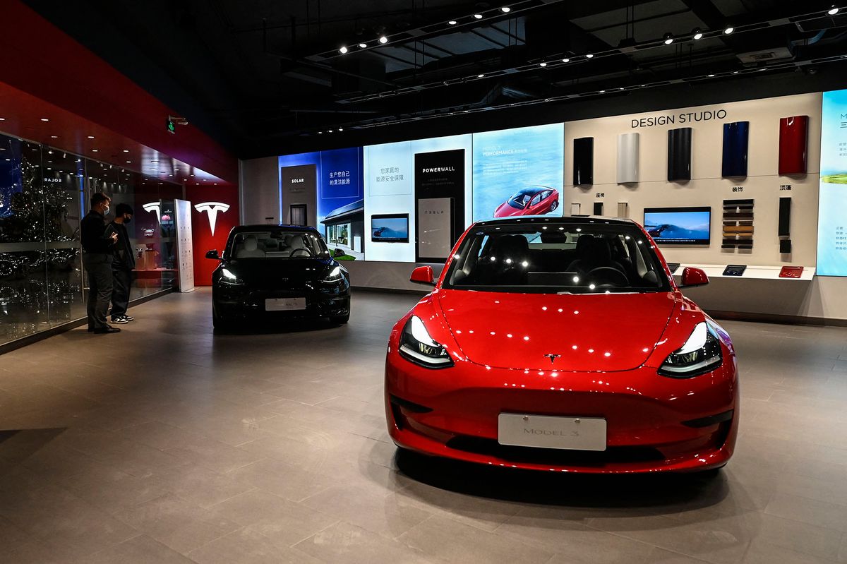 Tesla Model 3 cars are seen at a Tesla showroom at a shopping mall in Beijing on April 29, 2022. (Photo by Jade Gao / AFP)