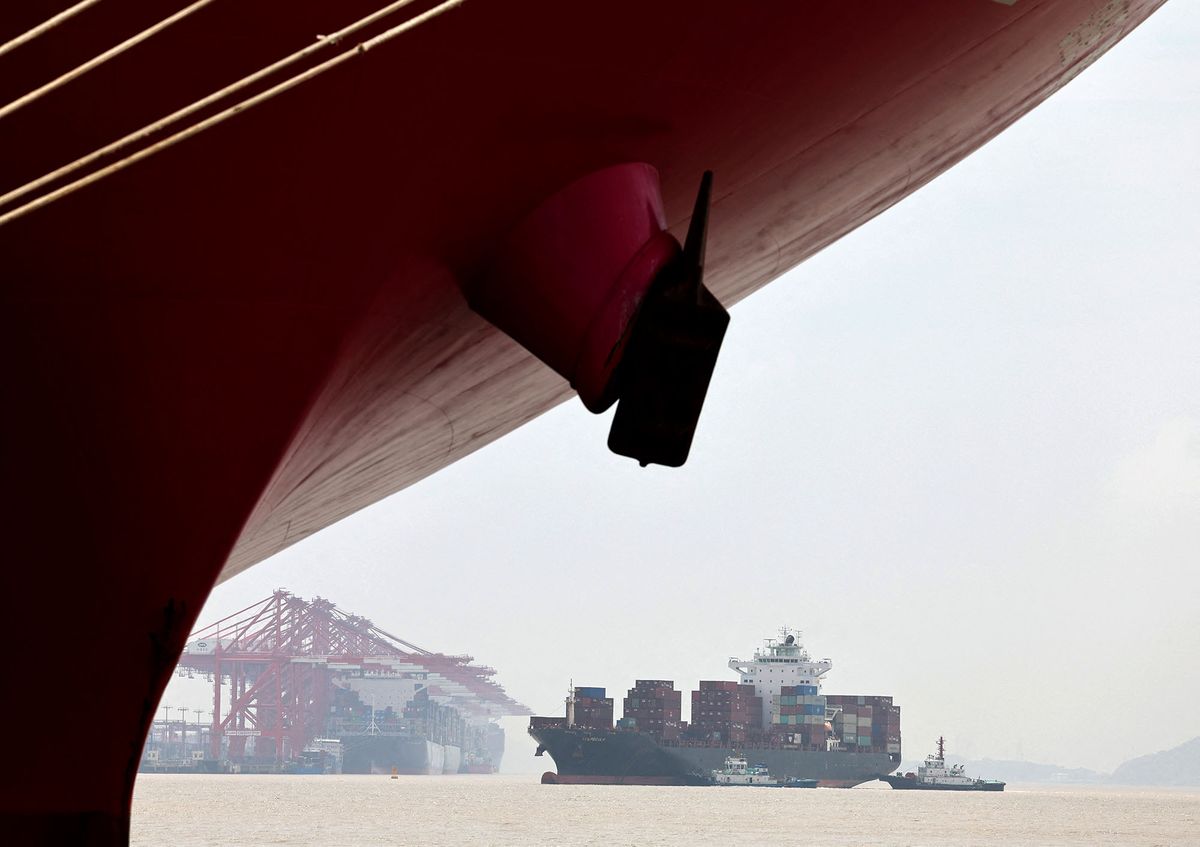 (220427) -- SHANGHAI, April 27, 2022 (Xinhua) -- A container ship sails towards the container dock of Shanghai's Yangshan Port in east China, April 27, 2022. About 25,000 staff members stick to their posts in Shanghai port to guarantee water transportation and improve logistics efficiency amid challenges caused by the recent resurgence of COVID-19 in Shanghai. (Xinhua/Chen Jianli) (Photo by CHEN JIANLI / XINHUA / Xinhua via AFP)