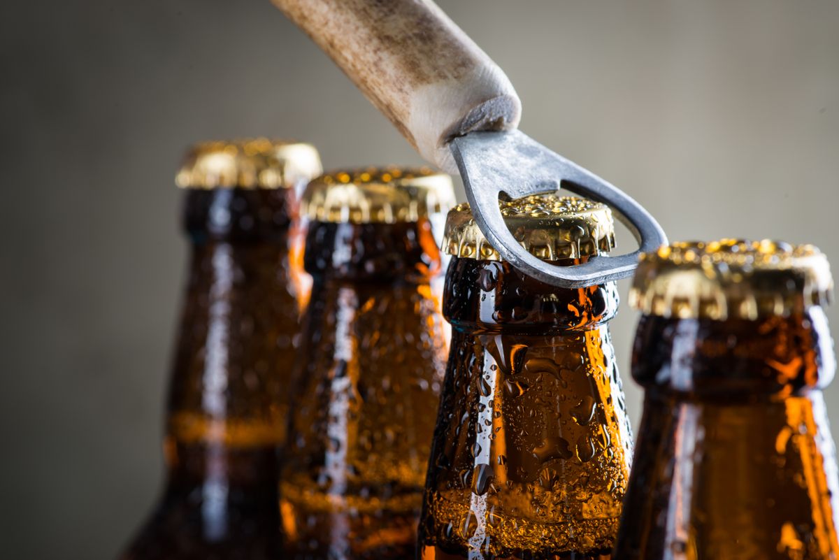 Brown,Ice,Cold,Beer,Bottles,With,Water,Drops,And,Old