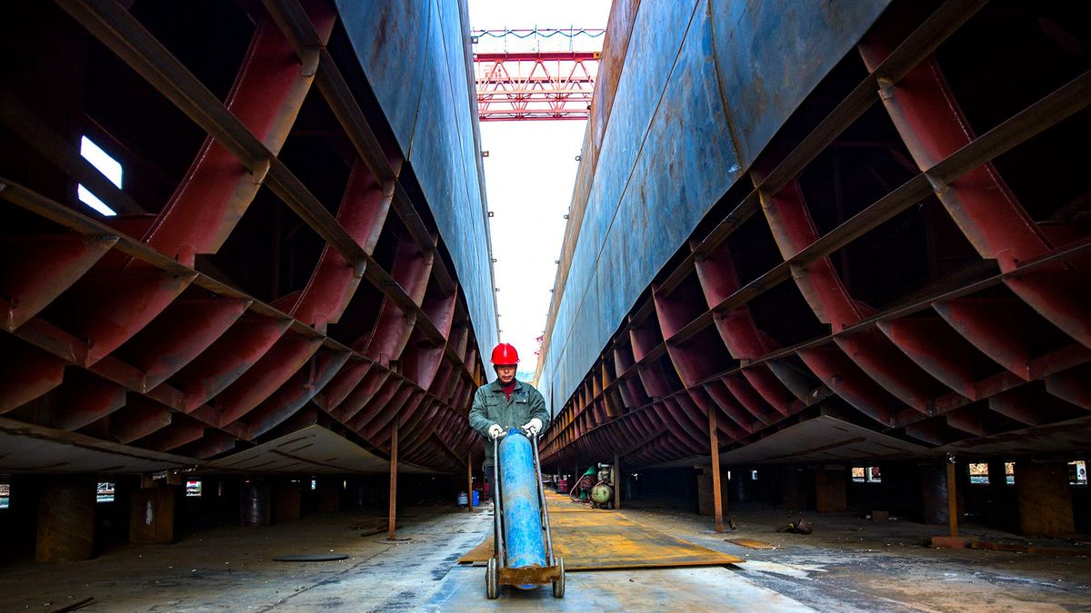 (210224) -- JIUJIANG, Feb. 24, 2021 (Xinhua) -- A staff member works at a shipbuilding yard of Duchang Shipyard Co., Ltd. in Duchang County of Jiujiang City, east China's Jiangxi Province, Feb. 24, 2021. The company has resumed production right after the Spring Festival holiday to ensure that orders are completed on time with good quality. (Photo by Fu Jianbin/Xinhua) (Photo by Fu Jianbin / XINHUA / Xinhua via AFP)