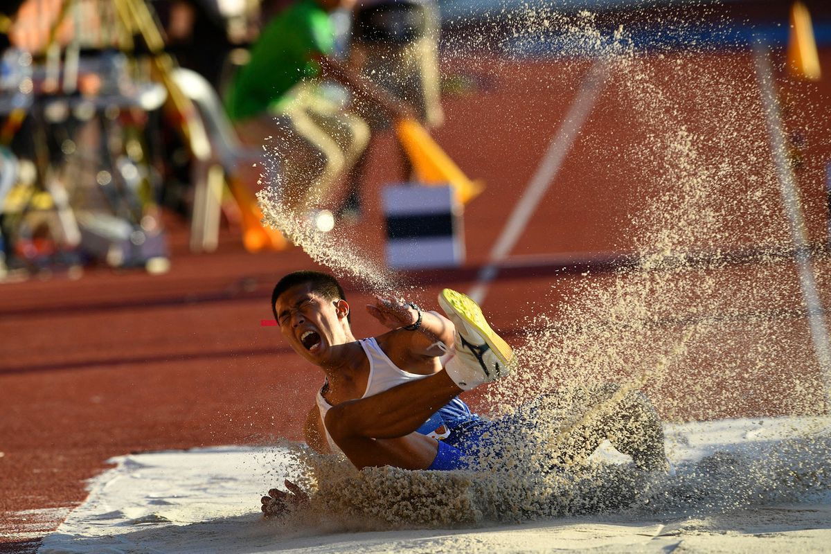 Ronne Malipay from the Philippines competes in the men's triple jump athletics event at the SEA Games (Southeast Asian Games) in Clark, Capas, Tarlac province, north of Manila on December 10, 2019. (Photo by TED ALJIBE / AFP)