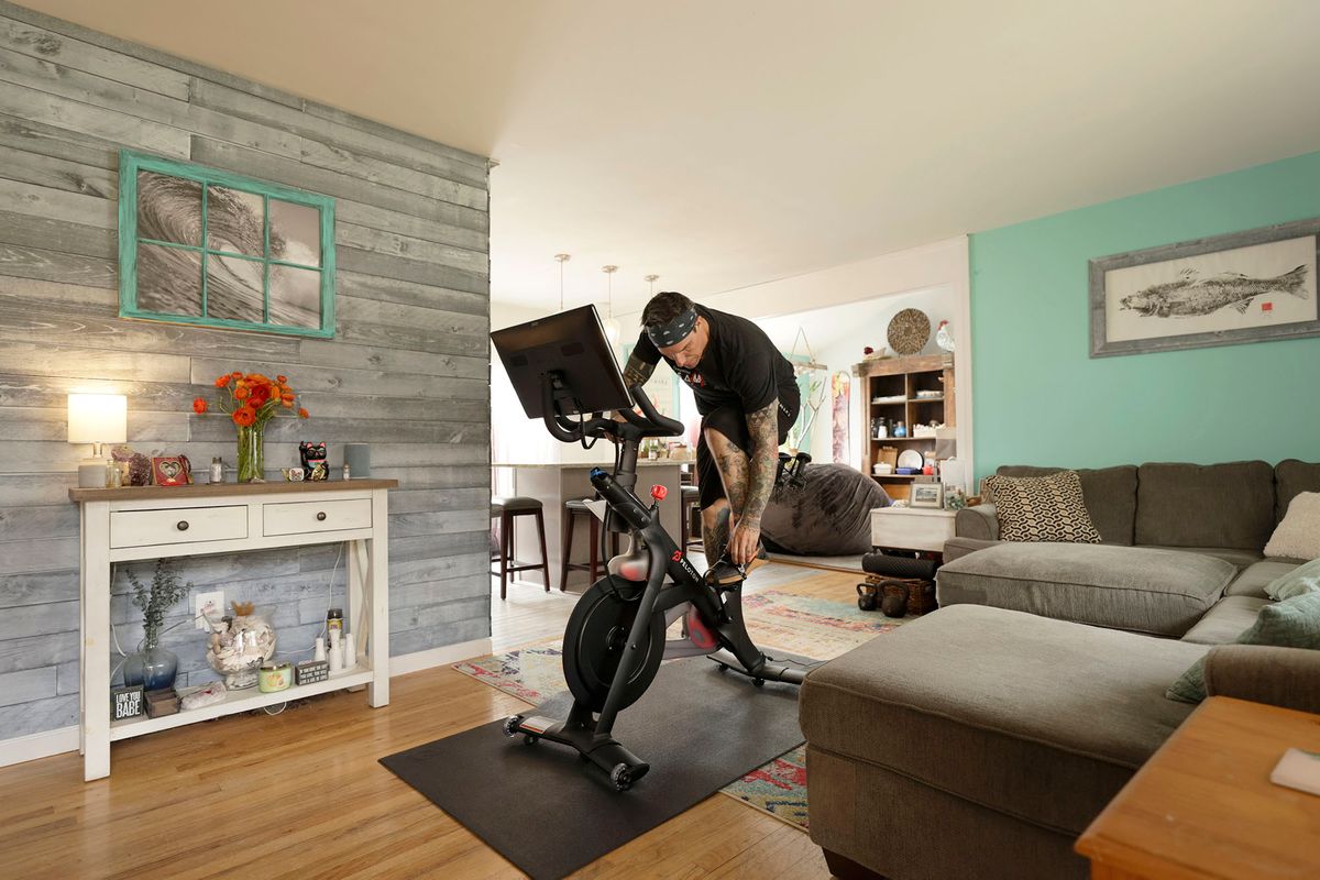 BRICK, NEW JERSEY - APRIL 16: Brody Longo prepares to work out on his Peloton exercise bike on April 16, 2021 in Brick, New Jersey. There is a competitive business war between indoor connected fitness devices fueled by quarantine life due to COVID-19.  (Photo by Michael Loccisano/Getty Images) 1313201692