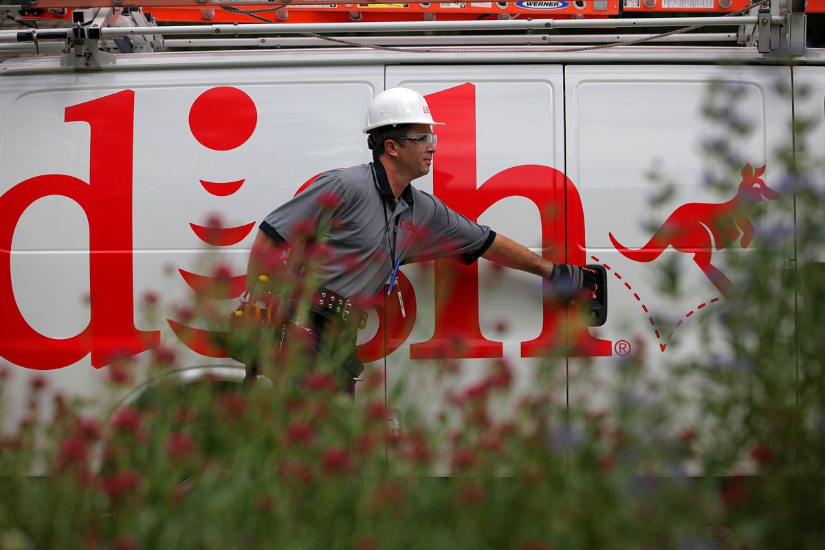Justin Preziosi, field service specialist for Dish Network Corp., arrives to install a satellite television system at a residence in Denver, Colorado, U.S., on Tuesday, Aug. 6, 2013. Dish Network Corp., the third-largest U.S. pay-TV company by customers, and Charter Communications Inc., the eighth-biggest, both may look to combine with competitors as a way to gain leverage in negotiations with TV networks to carry their programming. Photographer: Matthew Staver/Bloomberg via Getty Images 175738423