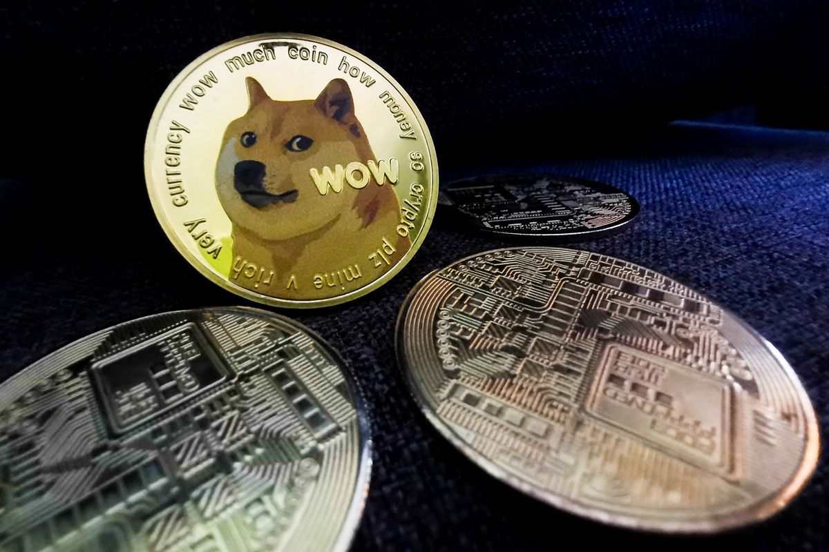 Representation of Bitcoin and Dogecoin cryptocurrencies are seen in this illustration photo taken in Sulkowice, Poland on August 10, 2021. (Photo Illustration by Jakub Porzycki/NurPhoto) (Photo by Jakub Porzycki / NurPhoto / NurPhoto via AFP)