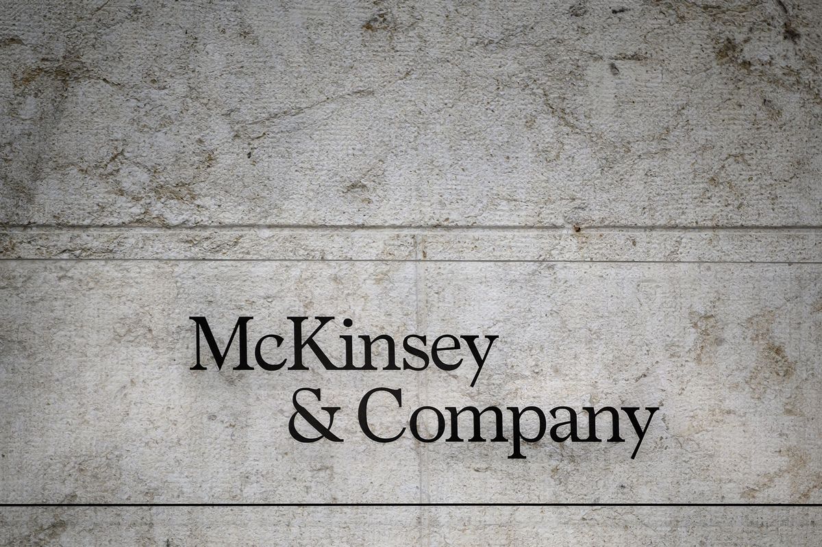 This photograph taken on April 12, 2022, shows a sign of US-based McKinsey & Company management consulting firm in Geneva. (Photo by Fabrice COFFRINI / AFP)