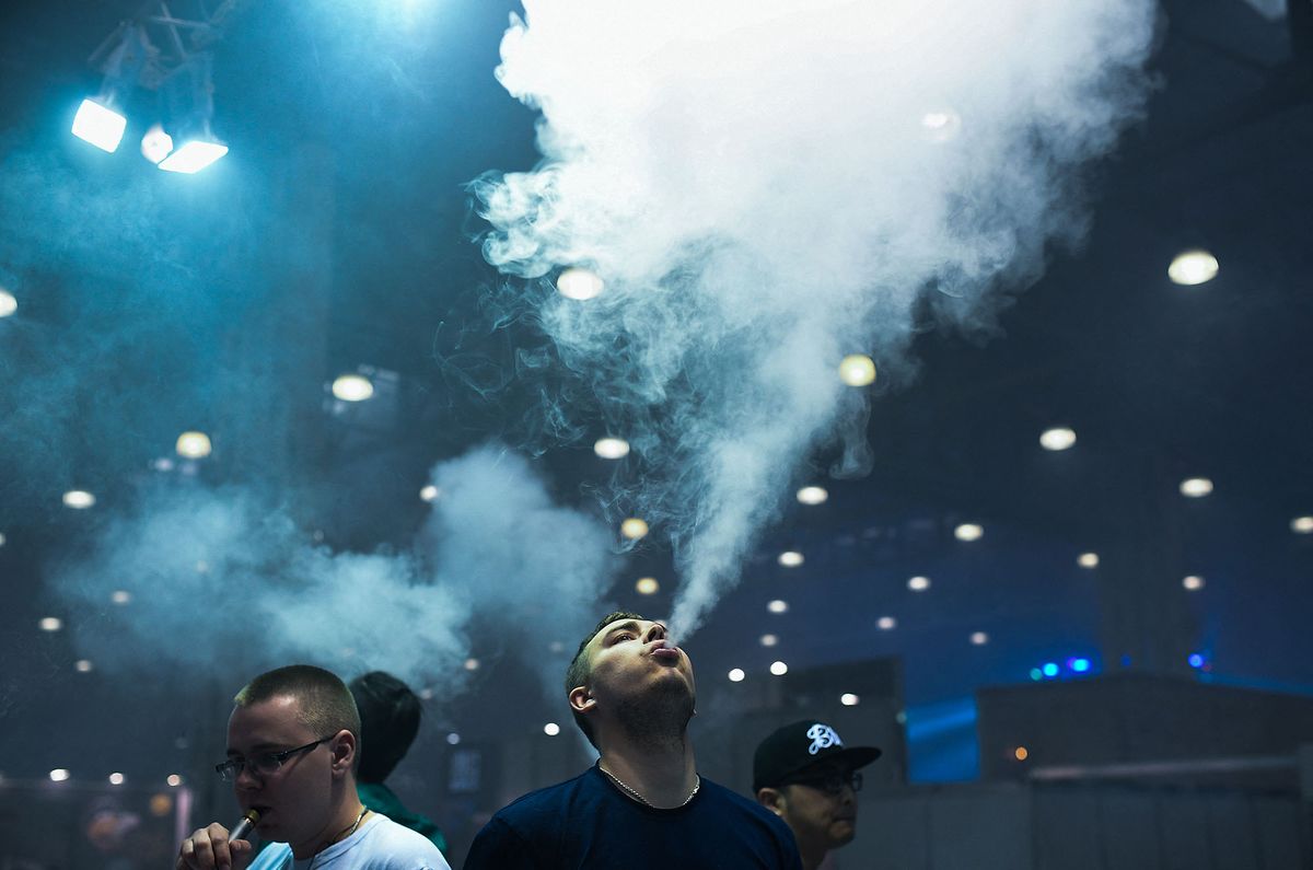 3126812 10.06.2017 Participants in the Global Vape 2017 specialized vape industry exhibition hosted by the Crocus City Hall, Moscow. Alexander Vilf / Sputnik (Photo by Alexander Vilf / Sputnik / Sputnik via AFP)