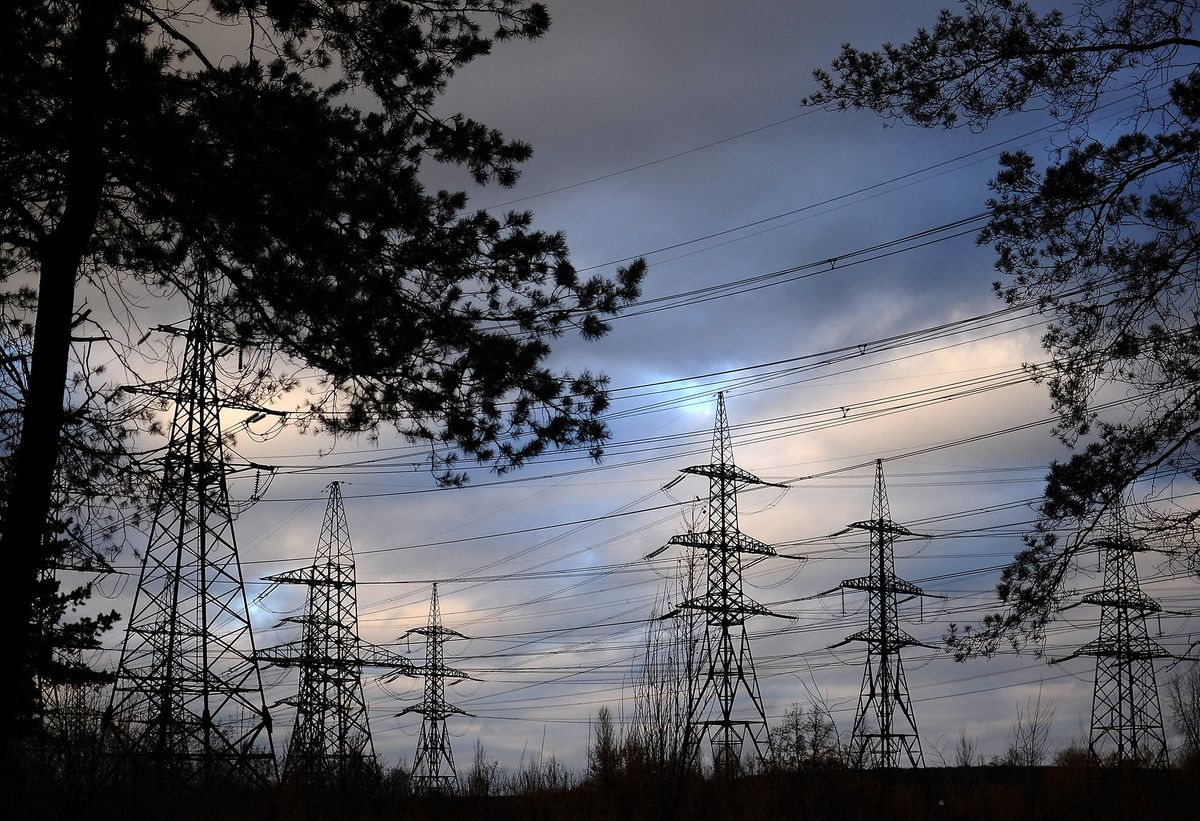 Electric power lines near of Ladyzhynskaya thermal power plant in the city of Ladyzhin, Vinnytsia region. Ukraine, Tuesday, November 23, 2015 Power Systems of Ukraine and Russia are working in this way that Russia does not have the technical capacity to disconnect part of the territory of Ukraine in response to an energy blockade of Crimea, said during a briefing in Kiev, the Minister of Energy and Coal Industry of Ukraine Volodymyr Demchishin. (Photo by Danil Shamkin/NurPhoto) (Photo by Danil Shamkin / NurPhoto / NurPhoto via AFP)
