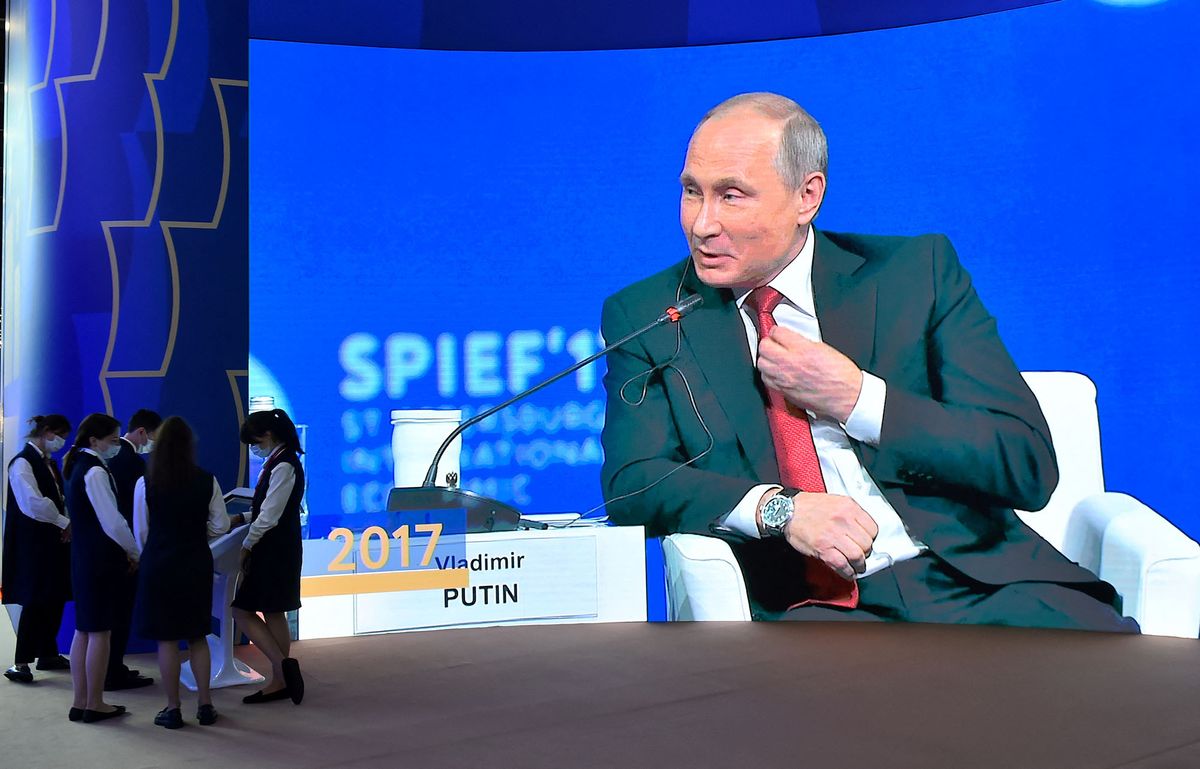 Screens show Russian President Vladimir Putin speaking during the St Petersburg International Economic Forum (SPIEF), at the ExpoForum convention and exhibition centre in Saint Petersburg, on June 15, 2022. (Photo by Olga MALTSEVA / AFP)