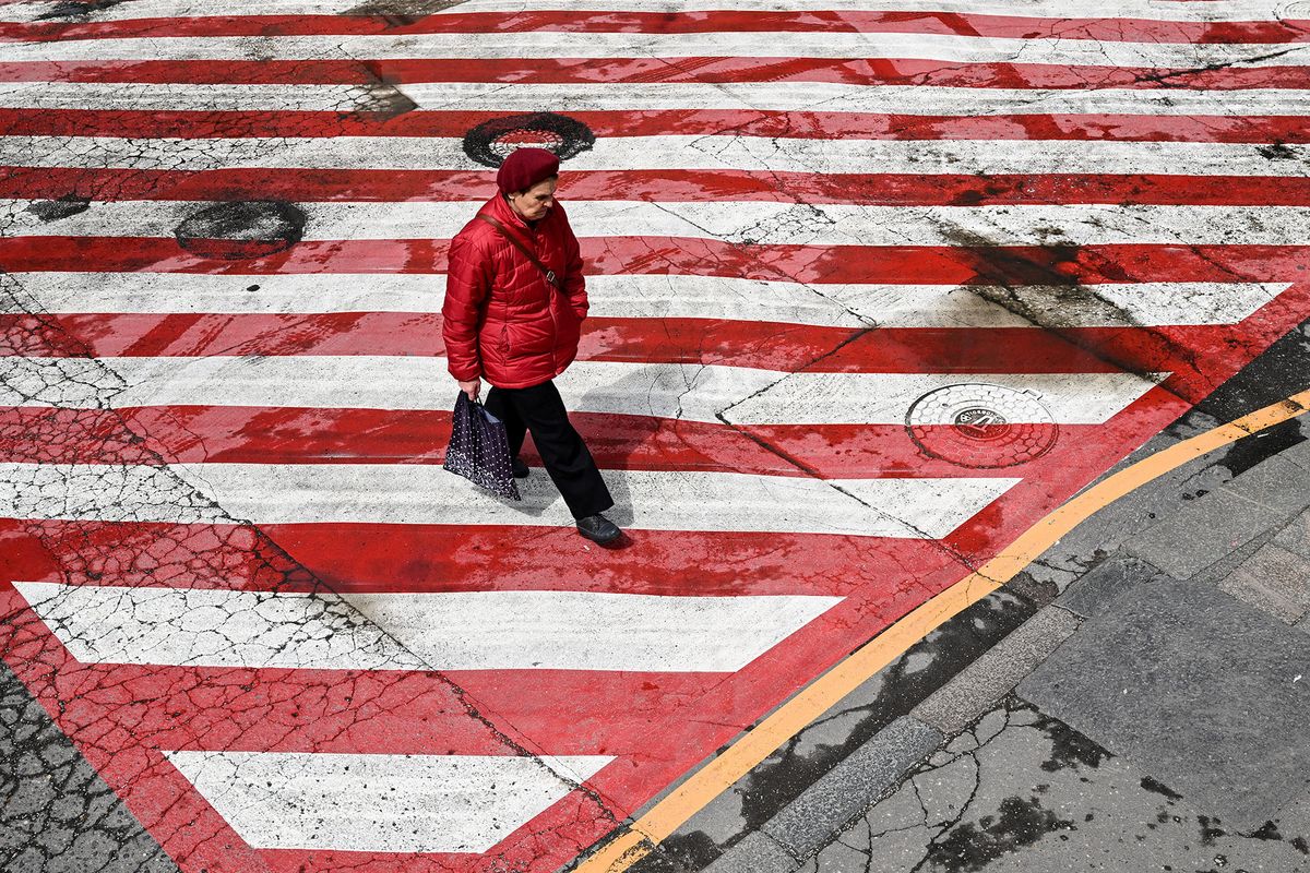 A woman walks on a street after a light rain in central Moscow on May 19, 2022. (Photo by Kirill KUDRYAVTSEV / AFP)