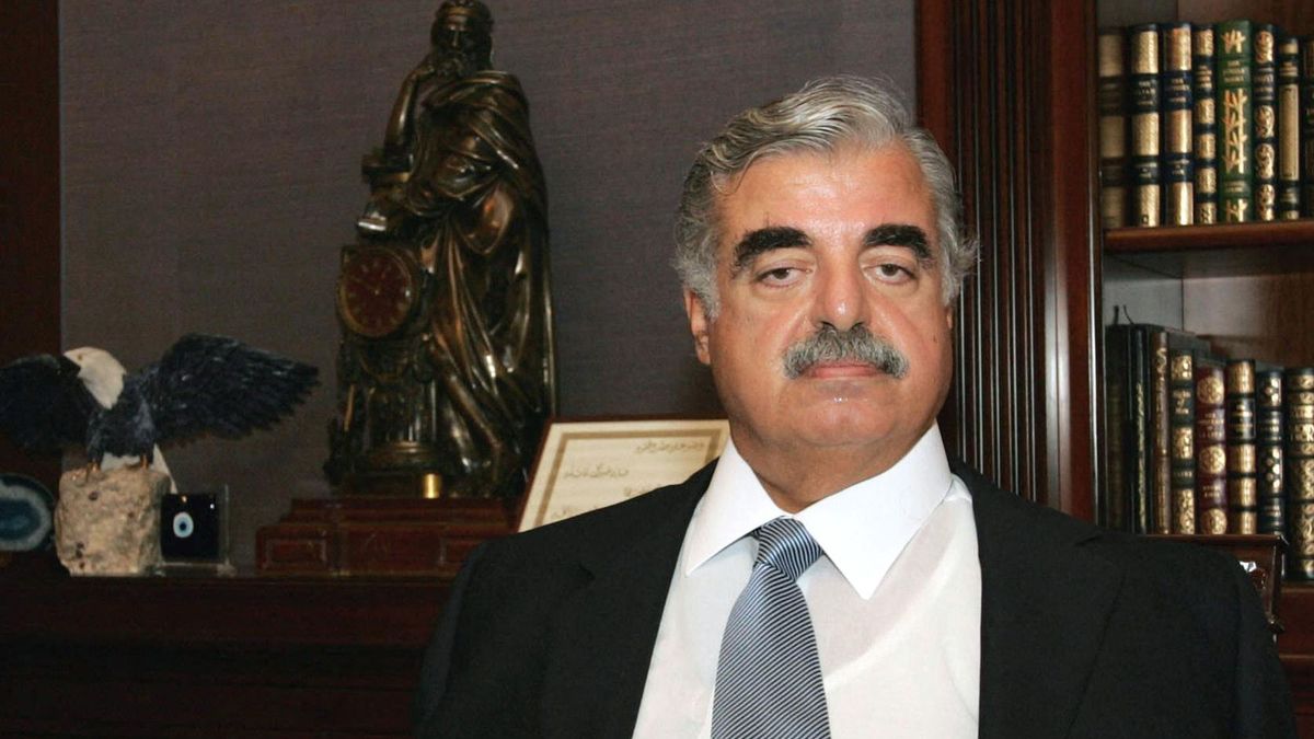 Lebanese Prime Minister Rafiq Hariri is seen with his fractured shoulder in a sling during an interview with AFP in Beirut 10 September 2004. Hariri begins a visit to Spain today following the announcement his government would resign this month. Meanwhile, the United Nations Human Settlements Program is to award Lebanon a prize for its work in rebuilding the country following the 1975-90 civil war and the multi-billionaire premier has been singled out to receive the award, to be given by UN Secretary General Kofi Annan in Barcelona on September 13. AFP PHOTO/Ramzi HAIDAR (Photo by RAMZI HAIDAR / AFP)