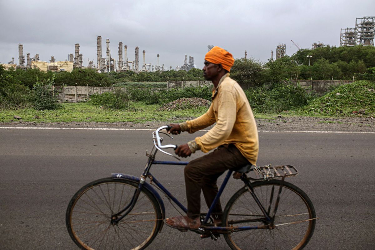 1234869707 The Reliance Industries Ltd. oil refinery in Jamnagar, Gujarat, India, on Saturday, July 31, 2021. The Indian city of Jamnagar is a money-making machine for Asia's richest man, Mukesh Ambani, processing crude oil into fuel, plastics and chemicals at the world's biggest oil refining complex that can produce 1.4 million barrels of petroleum a day. Photographer: Dhiraj Singh/Bloomberg via Getty Images