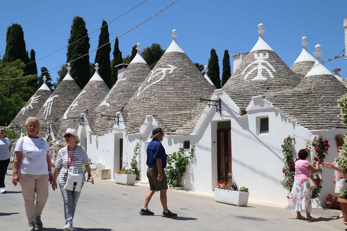 BARI, ITALY - JUNE 01: A general view of Alberobello's trullo houses, a traditional Apulian dry stone hut with a conical roof, in the Metropolitan City of Bari, Apulia region, Italy on June 01, 2022. Alberobello, a small town listed as one of the three important places in the UNESCO World Heritage List, continues to attract the attention of tourists with its unique houses. Salih Seref / Anadolu Agency (Photo by Salih Seref / ANADOLU AGENCY / Anadolu Agency via AFP)