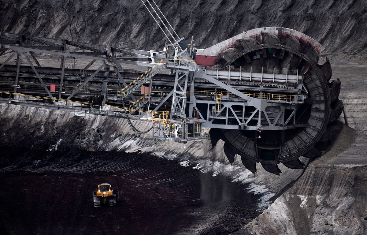 TOPSHOT - A bucket wheel excavator operates to dig brown coal at the Garzweiler lignite opencast mine of RWE in Jackerath, western Germany on April 25, 2019. (Photo by INA FASSBENDER / AFP)