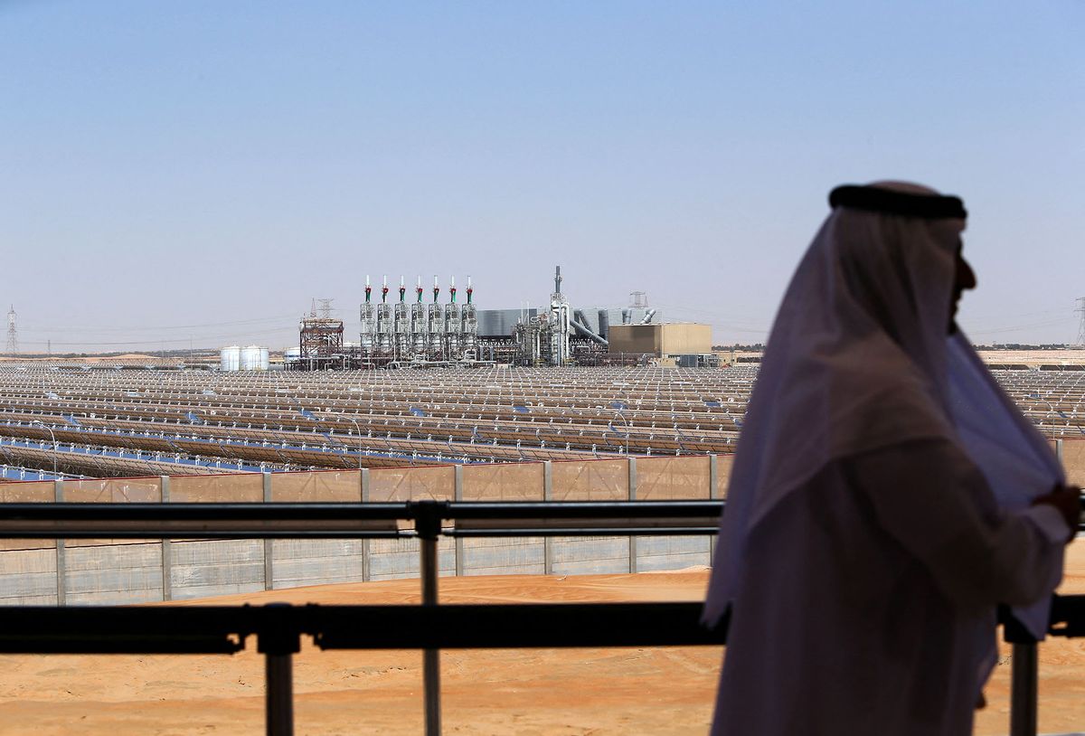 TO GO WITH STORY BY ALI KHALILAn Emarati man stands on a balcony overlooking the Shams 1, Concentrated Solar power (CSP) plant, in al-Gharibiyah district on the outskirts of Abu Dhabi, on March 17, 2013 during the inauguration of the facility. Oil-rich Abu Dhabi officially opened the world's largest Concentrated Solar Power (CSP) plant, which cost $600 million to build and will provide electricity to 20,000 homes. AFP PHOTO/MARWAN NAAMANI (Photo by MARWAN NAAMANI / AFP)