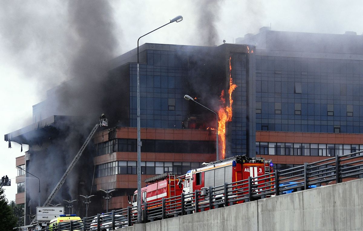 8207589 03.06.2022 Firefighters extinguish fire engulfed a business centre in western Moscow, Russia. Evgeny Odinokov / Sputnik (Photo by Evgeny Odinokov / Sputnik / Sputnik via AFP)
