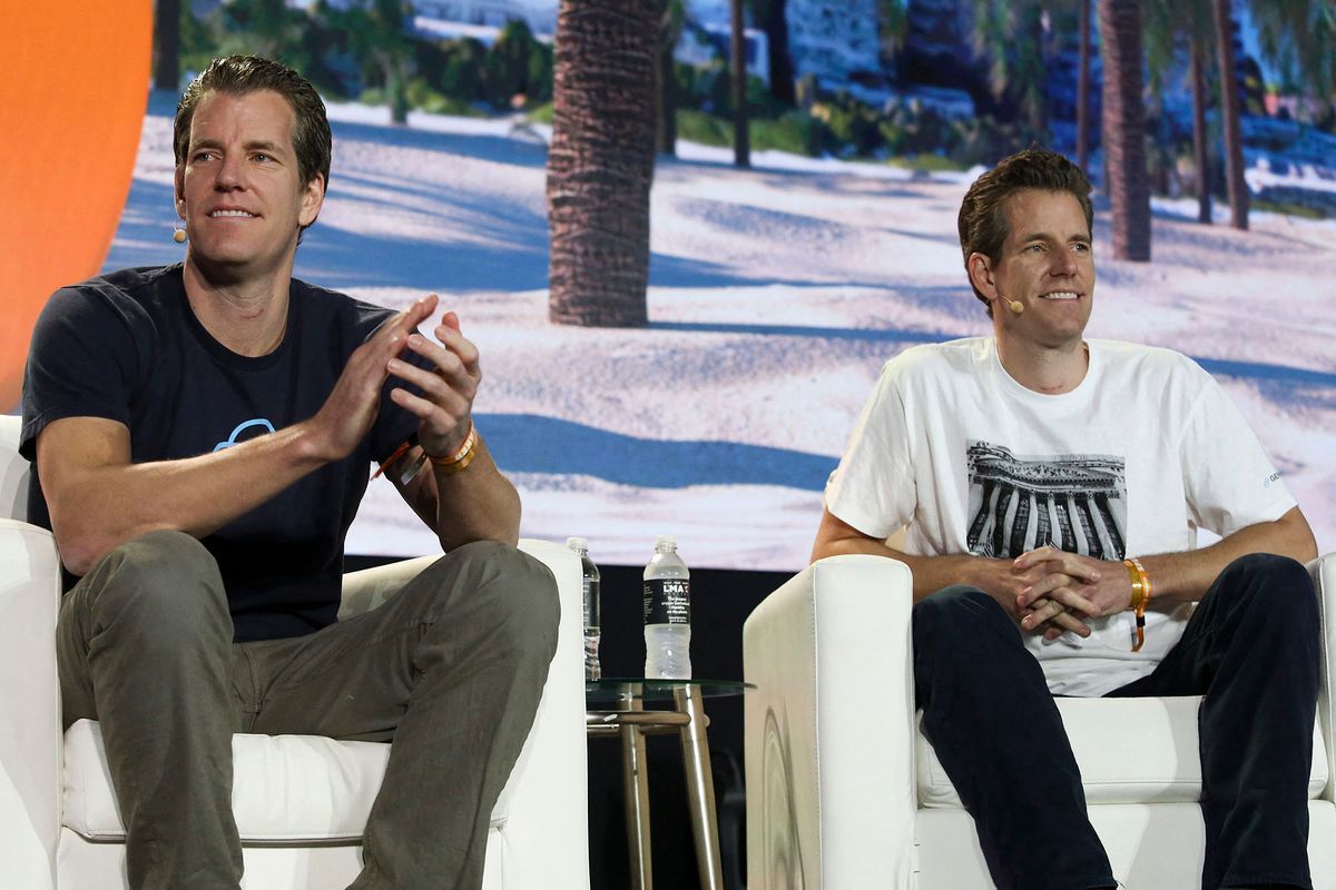 Tyler Winklevoss (L) and Cameron Winklevoss, founders of crypto exchange Gemini Trust Co., attend the crypto-currency conference Bitcoin 2021 Convention at the Mana Convention Center in Miami, Florida, on June 4, 2021. (Photo by Marco BELLO / AFP)