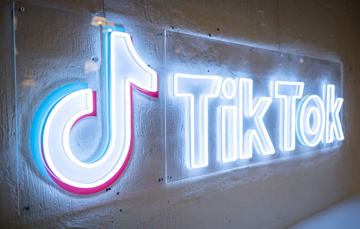 (FILES) This file photo taken on February 9, 2022 9shows the logo of video-focused social networking service TikTok, at the TikTok UK office, in London. - TikTok on Friday said Oracle will store all the data from its US users, in a bid to allay fears about its safety in the hands of a platform owned by ByteDance in China.The announcement came as the popular video snippet sharing service fended off concerns about the ability of engineers in China to access information about US users that isn't public. (Photo by Tolga Akmen / AFP)